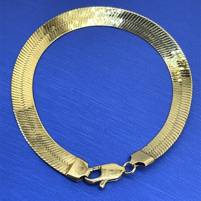10k Yellow gold herringbone bracelet 7 inch long 7 mm wide 6.9 g1